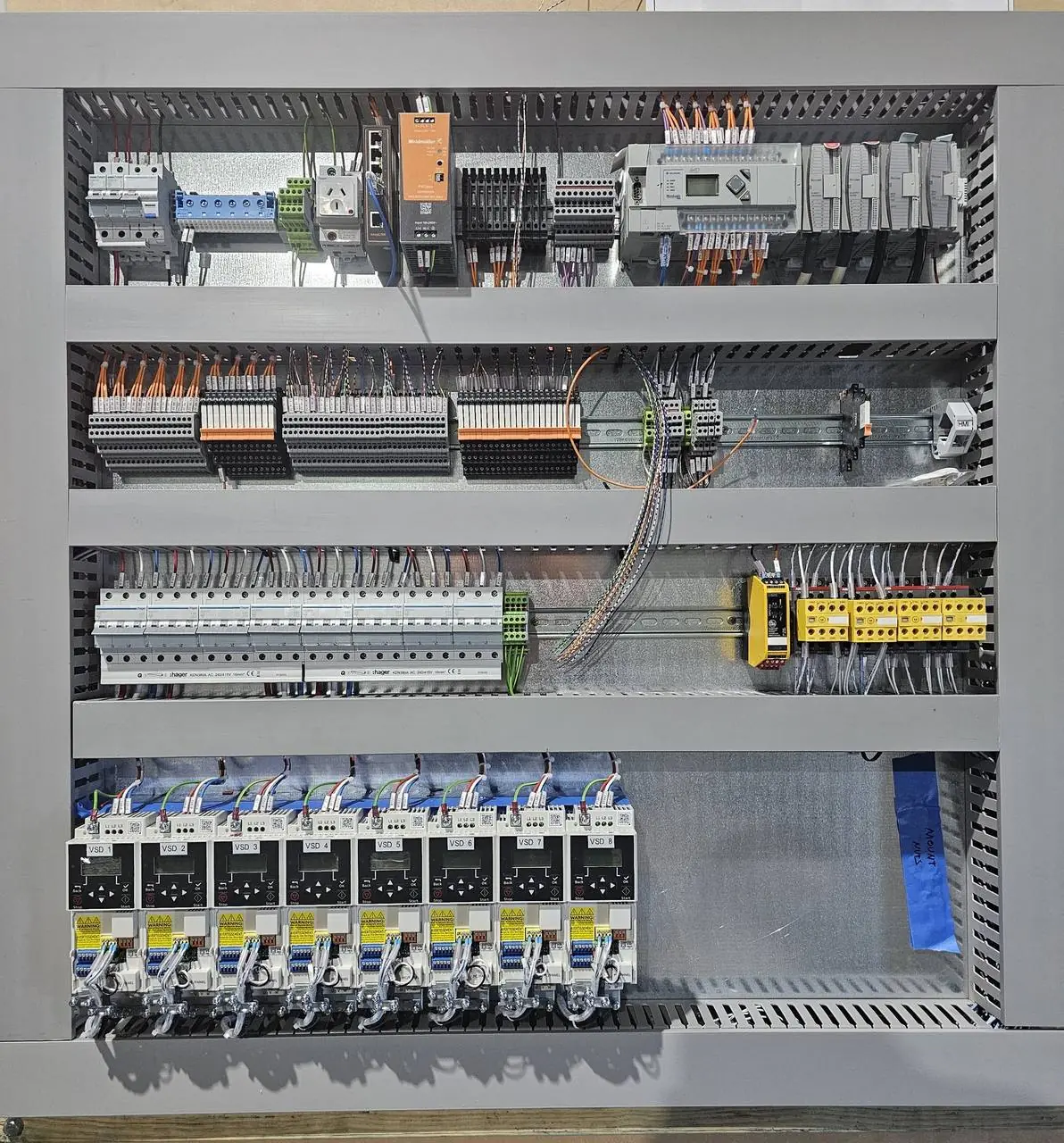 Finished conveyor control panel with duct lids fitted
