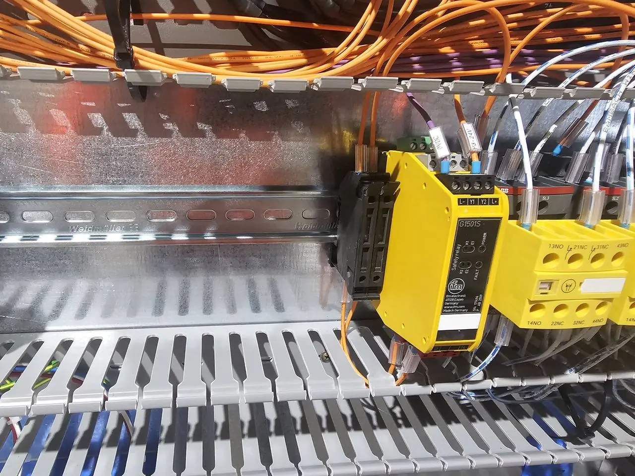 Safety relays wired in a conveyor control panel
