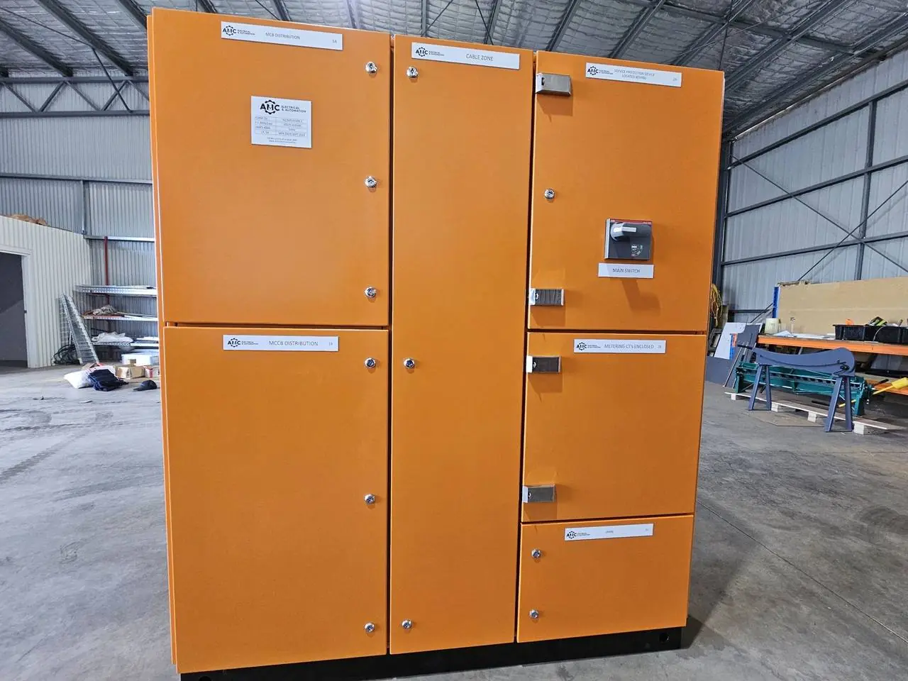 Large orange main switchboard in the AMC workshop