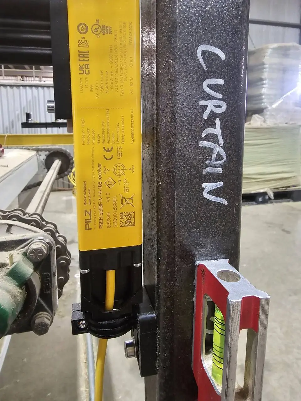 Pilz light curtain receiver installed on the machine frame