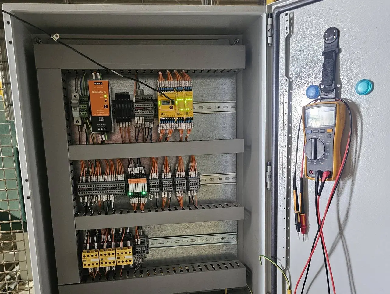 New safety control panel with Pilz safety controller and monitored contactors, live during testing