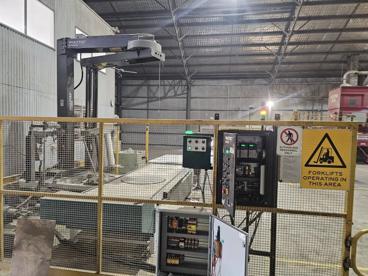 Pallet wrapper with new guarding, safety panel and stack light during commissioning